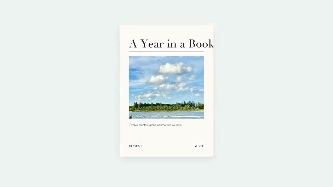 Year in Review cover with a lakeside meadow under a cloudy sky